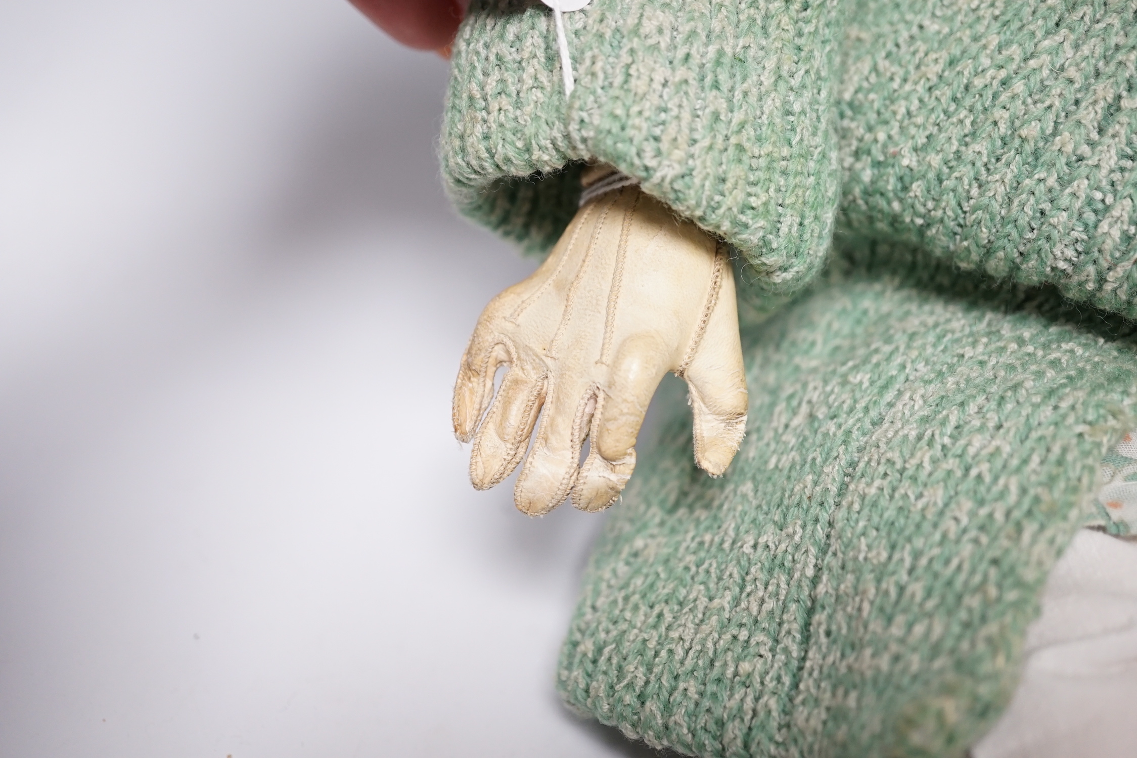 An AM390 bisque head doll, 63cm good condition, and an AM390, missing two fingers and wear on other hand, 58cm